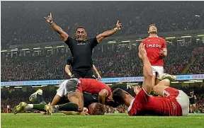  ?? GETTY IMAGES ?? All Blacks wing Sevu Reece celebrates Jordie Barrett’s first of two tries against Wales at Principali­ty Stadium in Cardiff.