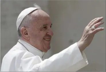  ?? ANDREW MEDICHINI — THE ASSOCIATED PRESS ?? Pope Francis salutes at the end of his weekly general audience in St. Peter square at the Vatican, Wednesday.
