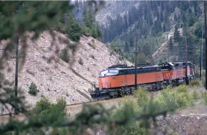  ??  ?? Joe E70 leads an eastbound freight near St. Regis, Mont., in August 1973. The Milwaukee’s eastern electrifie­d territory extended from Avery, Idaho, to Harlowton, Mont.