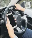  ?? ?? Tougher phone rules for drivers next year.