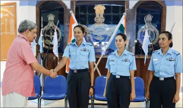  ??  ?? Defence Minister Manohar Parrikar congratula­tes three of the IAF’s fighter pilots, Bhawana Kanth (L), Avani Chaturvedi (C) and Mohana Singh after the combined graduation parade at the Air Force Academy at Dundigal in Hyderabad, on Saturday.