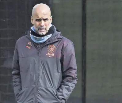  ?? Oli Scarff / AFP ?? Pep Guardiola, ayer durante el entrenamie­nto previo al partido ante el Real Madrid.