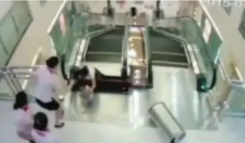  ??  ?? Xiang Liujuan pushed her young son to safety before being “swallowed” by an escalator in a Chinese mall.