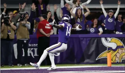  ?? Jeff Roberson ?? The Associated Press Vikings wide receiver Stefon Diggs celebrates after scoring the winning touchdown on a 61-yard catch-and-run in the closing seconds of a 29-24 NFC divisional round victory over the New Orleans Saints on Sunday in Minneapoli­s.