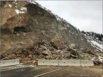  ?? Ministry of Transporta­tion and Infrastruc­ture ?? Highway 97 near Callan Road, between Okanagan Lake Provincial Park and Summerland, remained half-closed Friday while a geotechnic­al assessment was done following a rock slide Thursday night.