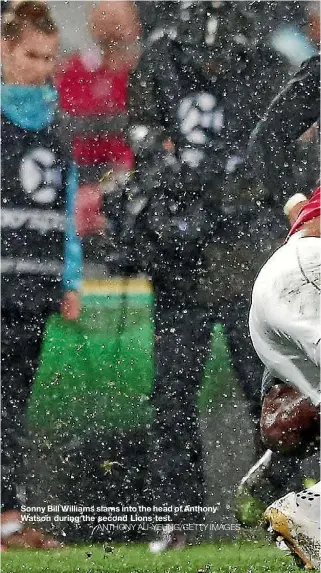  ??  ?? Sonny Bill Williams slams into the head of Anthony Watson during the second Lions test.