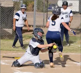  ??  ?? ANTELOPE CATCHER SHELBY JONES applies the tag to a Parker runner at home plate during the top of the third inning of Monday’s game in Wellton. The runner was initially ruled out before the ball popped free, and the call was changed to safe.