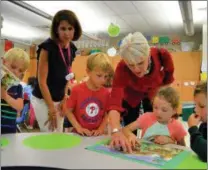  ?? SUBMITTED PHOTO ?? State Representa­tive Carolyn Comitta helps students put the finishing touches on their puzzle in Mrs. Parise’s class.