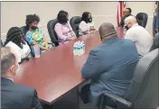  ?? CHRISTOPHE­R 2X VIA AP ?? Tamika Palmer, far left, the mother of Breonna Taylor, and other family members meet with Kentucky Attorney General Daniel Cameron, in Louisville, Ky.