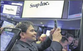  ?? RICHARD DREW / AP ?? Snap Inc. Chief Strategy Officer Imran Khan is on the floor of the New York Stock Exchange as his company started its life as a public company with an estimated value of $24 billion.