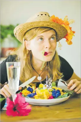  ?? Picture: SUPPLIED ?? A model poses with flowers from the garden on Taveuni.