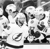  ?? FRANK GUNN/AP ?? Tampa Bay Lightning right wing Nikita Kucherov (86) is congratula­ted for his second-period goal in Toronto on Wednesday night.