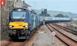  ?? DARREN FORD. ?? 2. April 13 at Penzance was the first time a dual-mode Direct Rail Services Class 88 had visited the West Country, when 88003 Genesis arrived on Pathfinder Tours’ ‘The Springtime Cornishman’, which it hauled with DRS 68034 from Tame Bridge Parkway. The ‘88’ arrives at Penzance, leading the ‘68’. 2