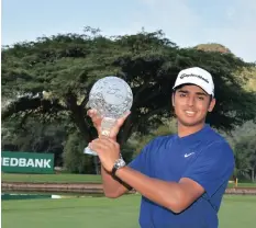  ??  ?? YURAV Premlall with his replica Nedbank Challenge Golf trophy