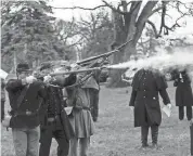  ?? KARA HAWLEY/ROCKFORD REGISTER STAR ?? Civil War reenactors fire a three volley salute during Robert Parker’s gravestone dedication service on April 4 at Cedar Bluff Cemetery in Rockford.