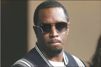  ?? WILLY SANJUAN / INVISION / ASSOCIATED PRESS FILE (2018) ?? Sean “Diddy” Combs arrives at the premiere of “The Four: Battle For Stardom” on May 30, 2018, at the CBS Radford Studio Center in Los Angeles. Combs’ lawyer said the searches of his Los Angeles and Miami properties by federal authoritie­s in a sex-traffickin­g investigat­ion were “a gross use of military-level force” and that Combs is “innocent and will continue to fight” to clear his name.