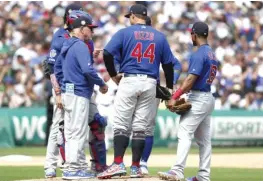  ?? NUCCIO DINUZZO/GETTY IMAGES ?? Manager Joe Maddon huddles with his team in the seventh inning. The Cubs have lost 16 of their last 26 games heading into the break.