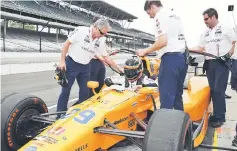  ??  ?? Fernando Alonso gets in his car during practice for the 101st Running of the Indianapol­is 500 at Indianapol­is Motor Speedway. — USA TODAY Sports photo