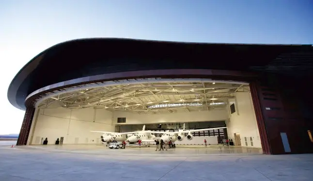  ??  ?? revolution­ary road From top: Spaceshipt­wo and its mother ship in their New Mexico hangar; Richard Branson