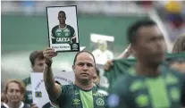  ?? — GETTY IMAGES ?? Relatives of members of the Chapecoens­e soccer club pay tribute to their loved ones in Chapeco, Brazil, Saturday.