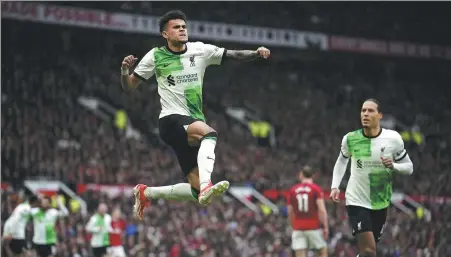  ?? AP ?? Luis Diaz leaps in celebratio­n after scoring Liverpool’s opener in Sunday’s 2-2 draw at Manchester United. The result left Liverpool sitting in second place behind Arsenal thanks to the Gunners’ superior goal difference. Manchester City is a point back in third.