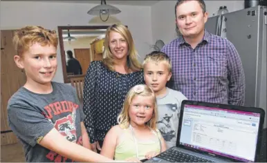  ?? Picture: Chris Davey FM2762342/FM2762345
Buy pictures from kentonline.co.uk ?? Aidan Moss with his sister Freya, seven, brother Finlay, eight, and parents Jo and Andrew; right, with teacher Chris Johnson, who guided him to an A* in maths at the age of 11