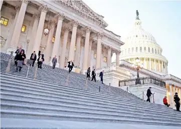  ??  ?? Members of the House of Representa­tives leave for Christmas break after passing a stopgap measure that will avoid a government shutdown one day before the deadline, at the US Capitol in Washington, DC. — AFP photo