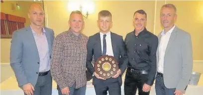  ??  ?? Kavan Hurn receives the Bob Matthewson Award at the Lancashire FA’s Referees Awards night