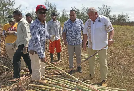  ?? Photo: Yogesh Chandra ?? Fiji Sugar Corporatio­n chief executive officer Graham Clark (right) with landowners of Nasarawaqa, Bua on December 14, 2018.
