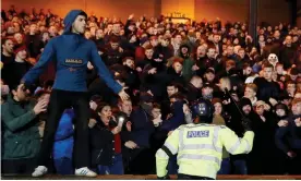  ?? Carl Recine/Action Images Photograph: ?? Fans and police during the Checkatrad­e Trophy match between Port Vale and Stoke.