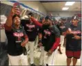  ?? DAVID S. GLASIER — THE NEWS-HERALD ?? Jose Ramirez, left, with phone, takes a selfie with teammates during the AL Central clinch celebratio­n at Progressiv­e Field on Sept. 17.