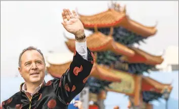  ?? Mel Melcon Los Angeles Times ?? REP. ADAM B. SCHIFF of Burbank kept his cool demeanor — if not his standard navy suit jacket — even with protesters Saturday as he campaigned during Los Angeles’ annual Golden Dragon Parade in Chinatown.