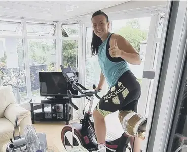  ??  ?? CYCLE: Halifax lass and Wigan Warriors player Paige Costello braved a 30 hour static bike ride.