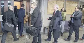  ?? ANDREW VAUGHAN / THE CANADIAN PRESS ?? Interested parties head into Nova Scotia Supreme Court last week in the QuadrigaCX case. A judge is expected to decide Thursday who will represent the creditors.