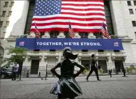  ?? Mark Lennihan/Associated Press ?? The Fearless Girl statue, photograph­ed in July, faces the New York Stock Exchange.