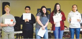 ?? Westside Eagle Observer/MIKE ECKELS ?? Eighth-grade students display their Character Awards during Decatur Middle School’s Honors Awards assembly held in the high school cafeteria Jan. 18.