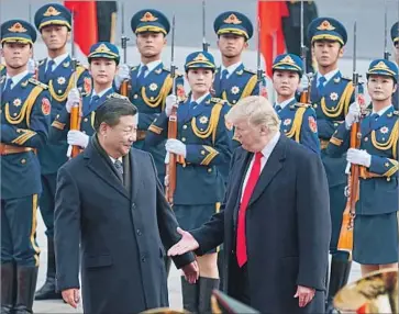  ?? Artyom Ivanov/Tass TNS ?? CHINESE PRESIDENT Xi Jinping, left, and U.S. President Trump in a public event Thursday in Beijing.