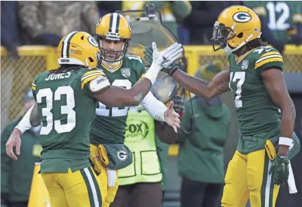  ?? DAN POWERS / USA TODAY NETWORK-WISCONSIN ?? Green Bay Packers running back Aaron Jones could be celebratin­g more touchdowns with quarterbac­k Aaron Rodgers and wide receiver Davante Adams, right, next season.
