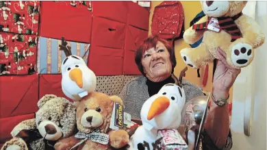  ?? CLIFFORD SKARSTEDT EXAMINER ?? Frieda Rutherford takes a break during her third annual Food and Toy Drive at her home on Wednesday in Peterborou­gh.