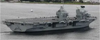  ??  ?? Vulnerable: Carrier HMS Queen Elizabeth at Invergordo­n port during sea trials