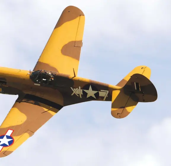  ??  ?? The Fighter Collection’s P-40F Warhawk in action during the 2012 Flying Legends Airshow.