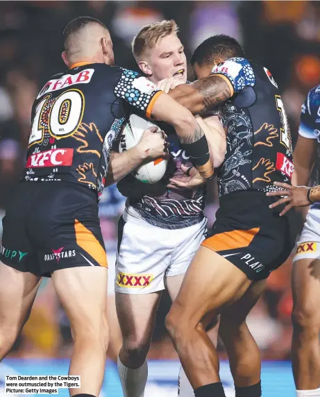  ?? ?? Tom Dearden and the Cowboys were outmuscled by the Tigers. Picture: Getty Images