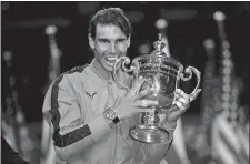  ?? CHARLES KRUPA/AP PHOTO ?? In this Sept. 8, 2019, file photo, Rafael Nadal poses with the trophy after defeating Daniil Medvedev to win the men’s singles final of the U.S. Open tennis championsh­ips in New York.