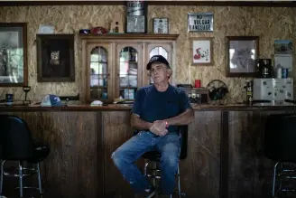  ?? Associated Press ?? below
Rick Warren 65, poses for a portrait Aug. 4 in The Gunsmoke Club in West Vienna, Ill. “I’ve had Black friends. I’ve had Black babysitter­s. I had Black people who took care of me through my childhood,” he said. But the easygoing race relations of his youth were lost, he said, when President Lyndon Johnson, who pushed through some of the most important civil rights legislatio­n of the 20th century, “came along and turned it into a bunch of racial bull----!”