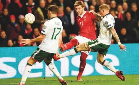  ?? Reuters ?? Stephen Ward and James McClean of Ireland in action against Nicklas Bendtner of Denmark (centre) during the 2018 World Cup qualifier in Copenhagen on Saturday. The match ended in a goalless draw.