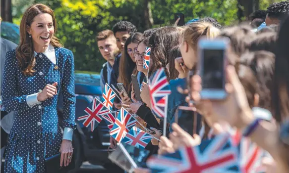  ?? Picture: HEATHCLIFF O’MALLEY/POOL/AFP ?? Catherine, the Duchess of Cambridge, is greeted by wellwisher­s as she arrives to visit Bletchley Park.