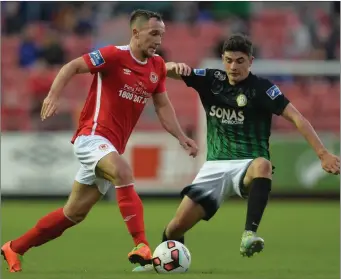  ??  ?? Graham Kelly of St Patrick’s Athletic looks to go past Bray’s Darragh Noone.