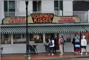  ?? ROBERT F. BUKATY — THE ASSOCIATED PRESS ?? High school students gather outside The Goldenrod, a popular restaurant and candy shop in York Beach, Maine, on Wednesday.