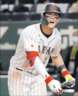  ?? Eugene Hoshiko
The Associated Press ?? Playing for his mom’s native Japan, Lars Nootbaar went 5-for-11 with two RBIS during the team’s 3-0 start at the World Baseball Classic.