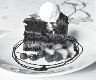  ?? Kimberly Park / Contributo­r ?? 51fifteen restaurant at the Galleria offers Godiva chocolate cake.